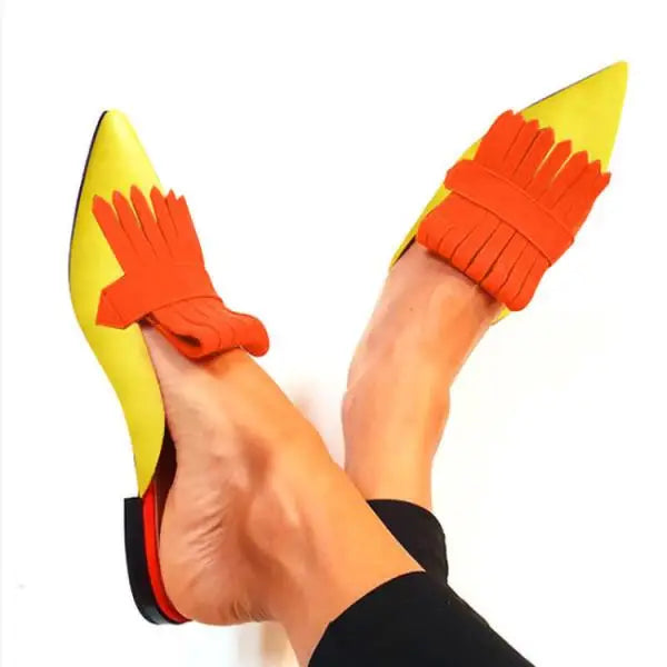 Black Montaracrest décolleté with open back and heel, stylish women's footwear, side view showing elegant design and heel height.