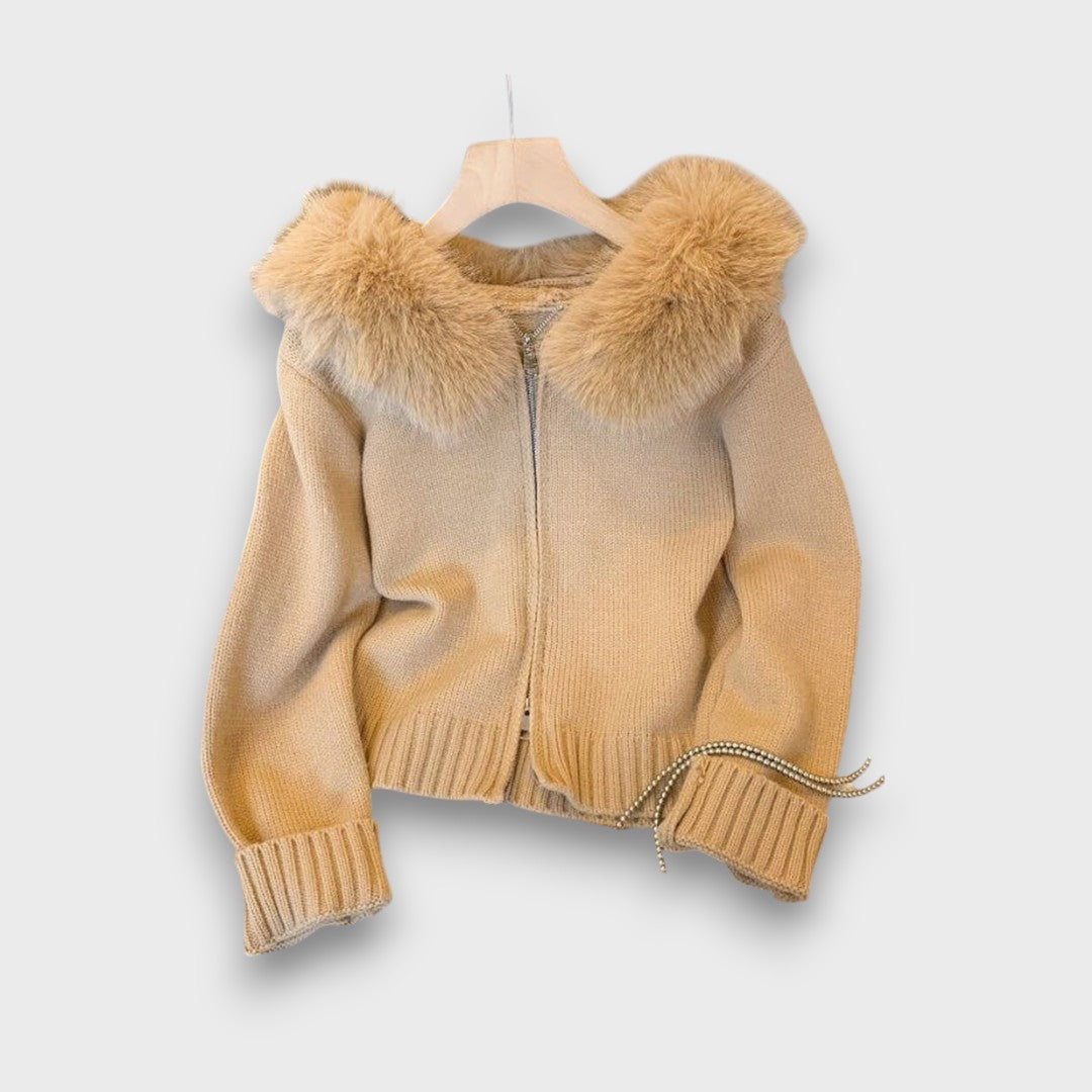 Montaracrest Alisanne knitted jacket with zip closure and faux fur collar, shown in a stylish blue color.