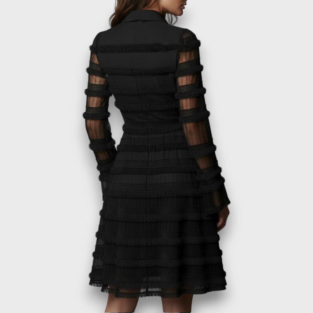 Montaracrest Parisa midi dress with transparent fringe, stylish and elegant, shown in a close-up image highlighting the detailed design.