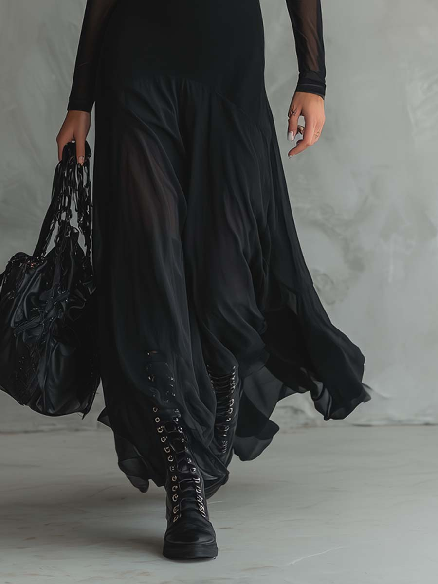 Montaracrest Neroa maxi loose-fit tulle dress in black, flowing and elegant, shown on a model.
