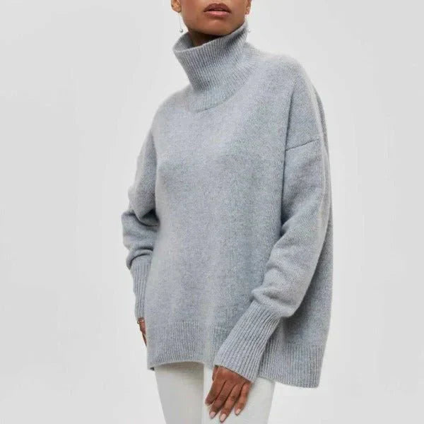 Amanda oversized dolcevita sweater by Montaracrest, cream-colored knit with relaxed fit and ribbed collar and cuffs.