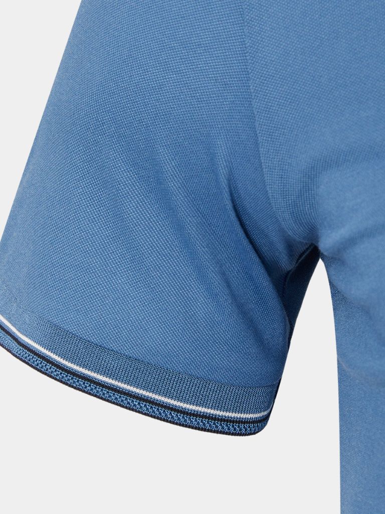Montaracrest Polo Classica Azure featuring a classic design with a cross crown logo, made from soft fabric for comfortable wear.