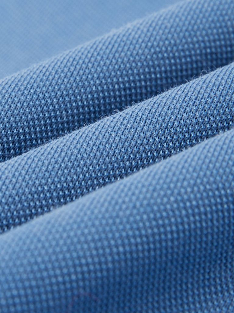 Montaracrest Polo Classica Azure in classic fit with a cross crown logo, featuring a button collar and short sleeves.