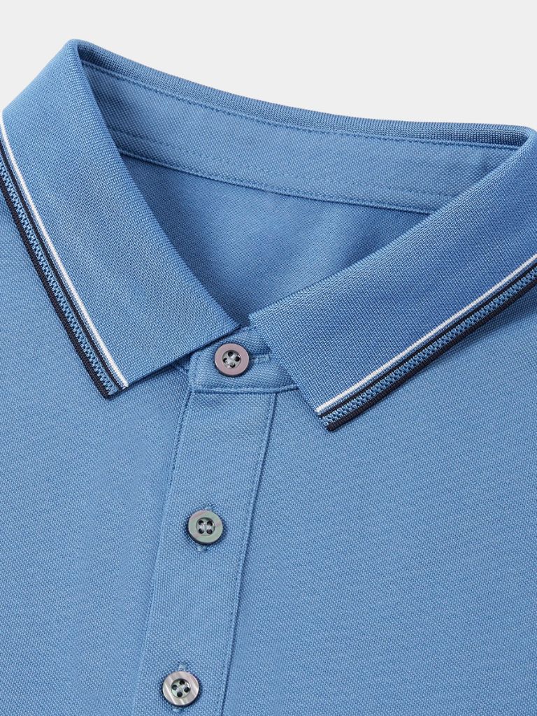 Montaracrest Polo Classica Azure in classic blue with a cross crown logo, made of comfortable, stylish polo fabric.