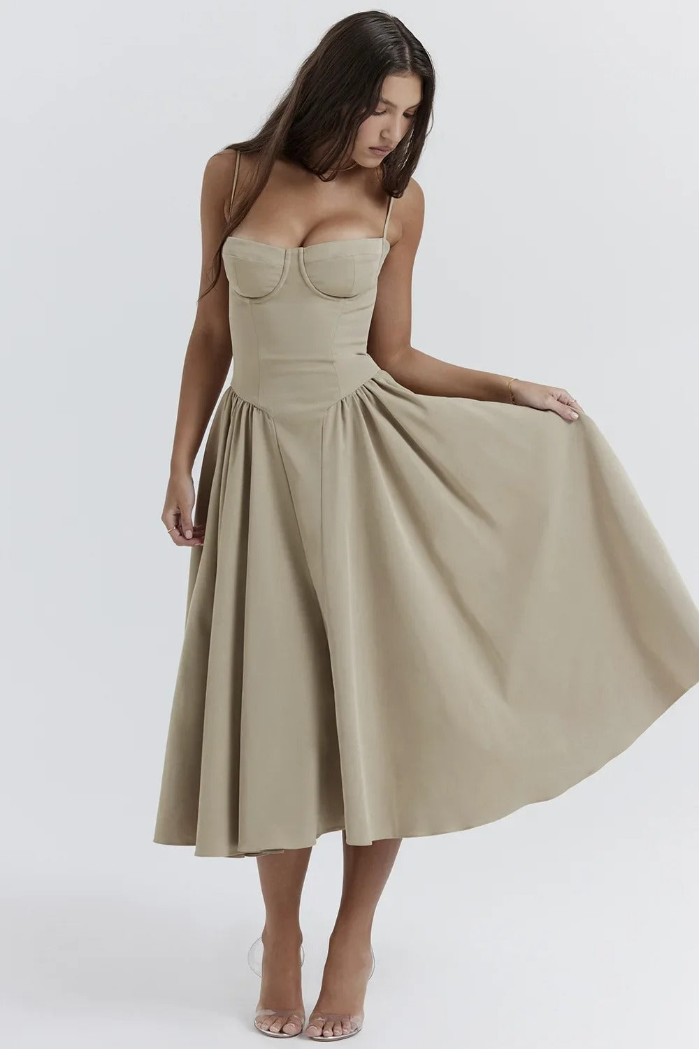 Mid-length pleated dress by Montaracrest featuring a structured bodice and convenient pockets, stylish and elegant for various occasions.