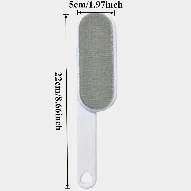 Montaracrest fabric and lint brush with a handle, designed for removing lint and fuzz from clothing and upholstery.
