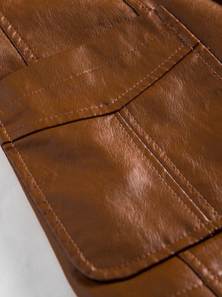 Caramel leather jacket by Montaracrest featuring a bold design with a cross crown detail, stylish and high-quality for men.