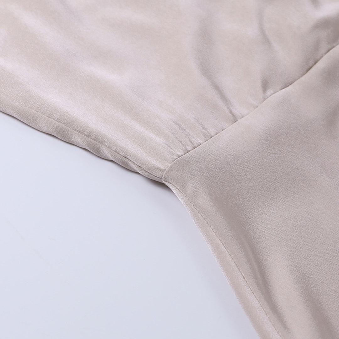 Elegant long slip dress with side slit from Montaracrest, featuring a flowing silhouette and stylish design.