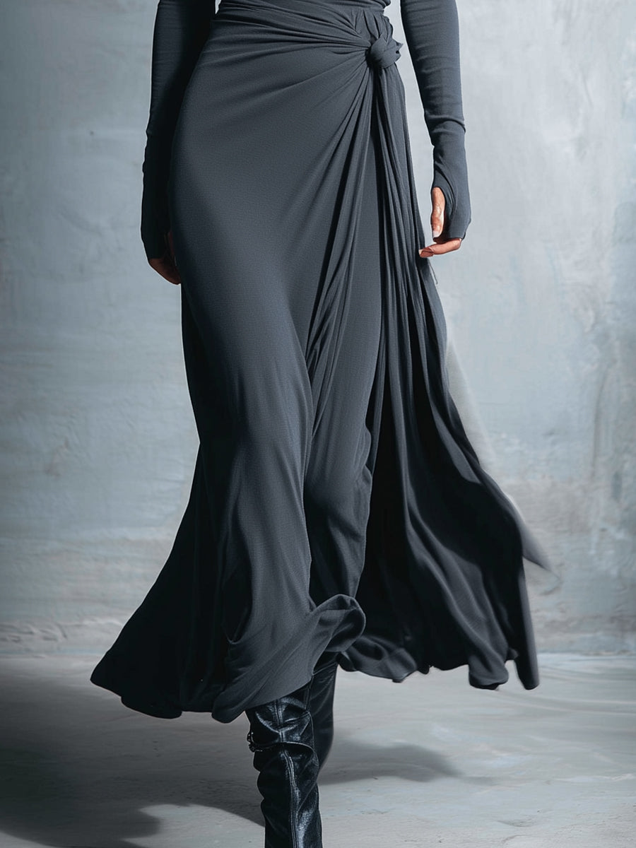 Vittoria maxi dress with side knot detail by Montaracrest, featuring flowing fabric and elegant design, shown on a model.