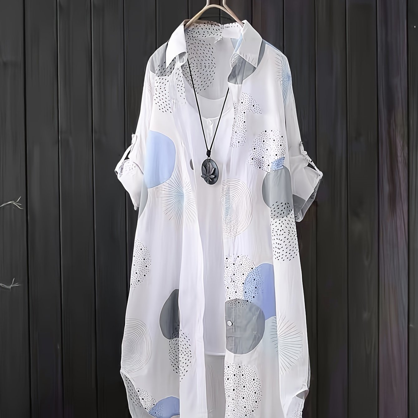 Light summer dress "Chiara" by Ravelli Milano featuring floral patterns and flowing fabric, perfect for warm weather.