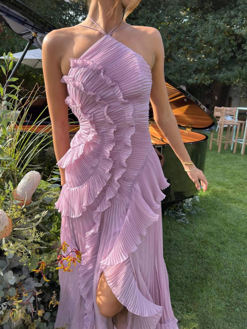 Elegant Montaracrest long pleated dress with halter neckline and ruffle details, showcased on a model.