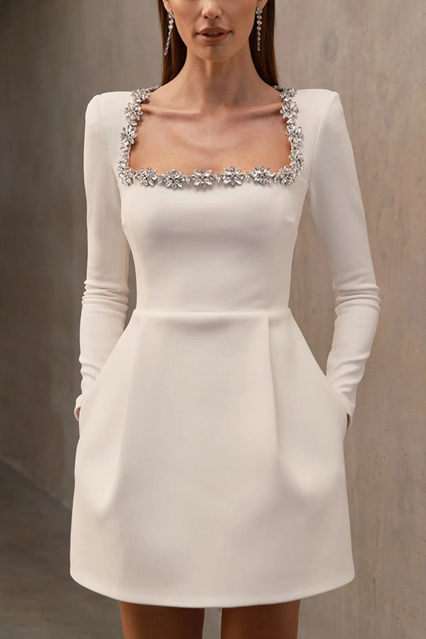Montaracrest mini A-line dress with jewelry-style embellishments, featuring a stylish and elegant design perfect for special occasions.