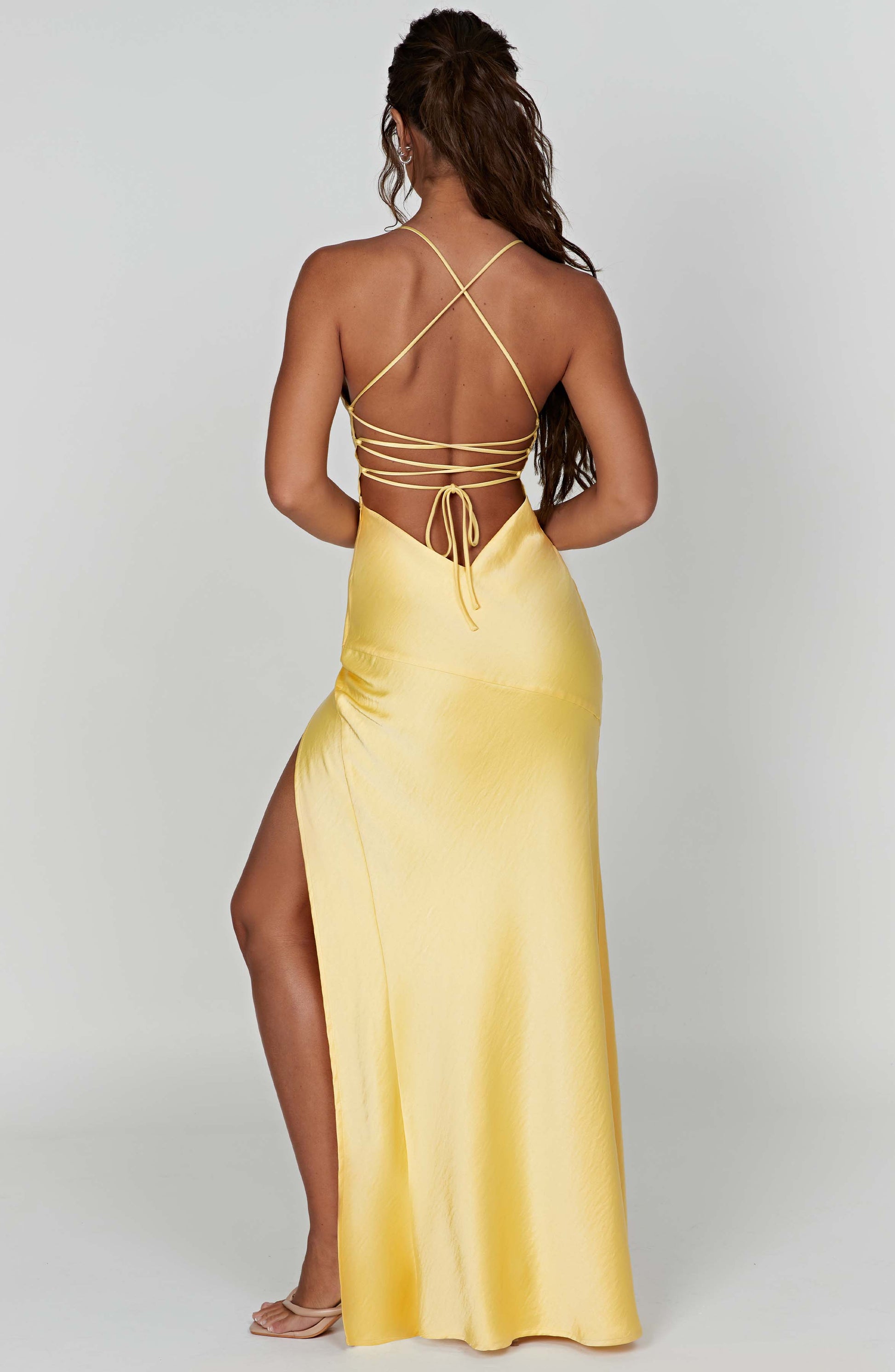 Montaracrest Adrielle Maxi Dress in lemon color, flowing fabric, sleeveless design, perfect for elegant summer occasions.