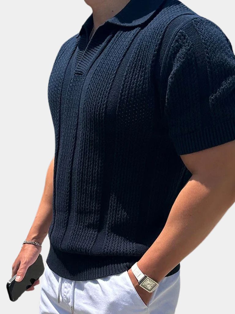 Ivory polo shirt by Montaracrest with a cross crown logo, featuring a classic collar and short sleeves.
