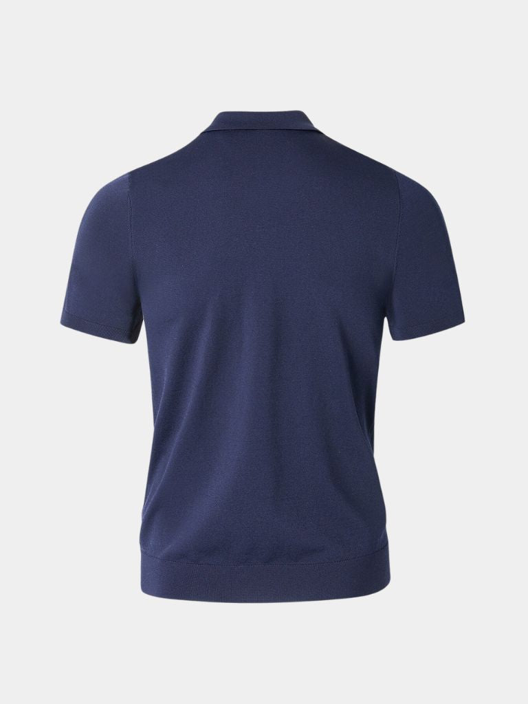 Navy Polo Classe Marina by Montaracrest featuring a classic polo shirt with a cross crown emblem on the chest.