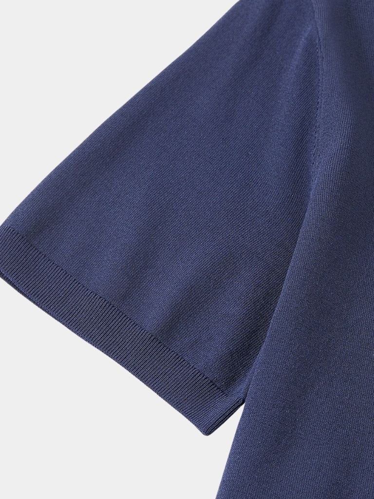 Navy Polo Classe Marina by Montaracrest featuring a classic polo shirt with a crown emblem on the chest.