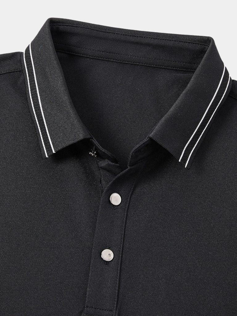 Montaracrest polo shirt with obsidian-colored trim and cross crown detail, showcasing a stylish, fitted design.