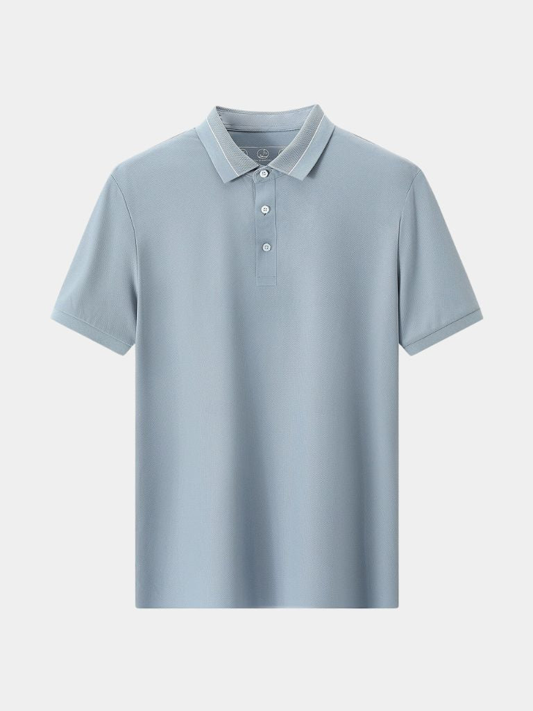 Steel grey Polo by Montaracrest featuring a classic collar and embroidered cross crown logo on the chest.