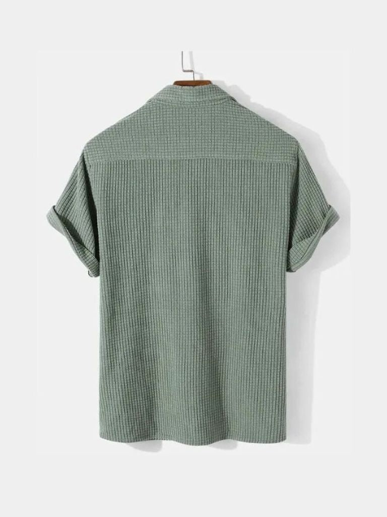 Montaracrest textured short-sleeve shirt with a cross crown pattern, stylish men's casual shirt with a textured fabric design.