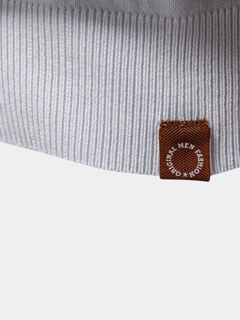 Ivory Polo shirt by Montaracrest, featuring a cross and crown design on the front.