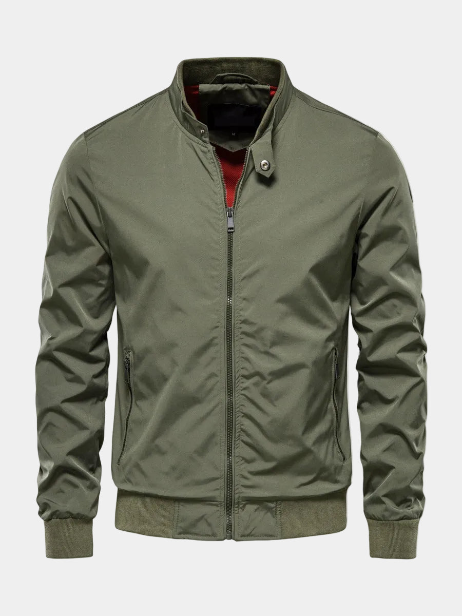 Green Stealth Onyx bomber jacket by Montara & Crest, slim-fit antivento design, shown on a hanger.