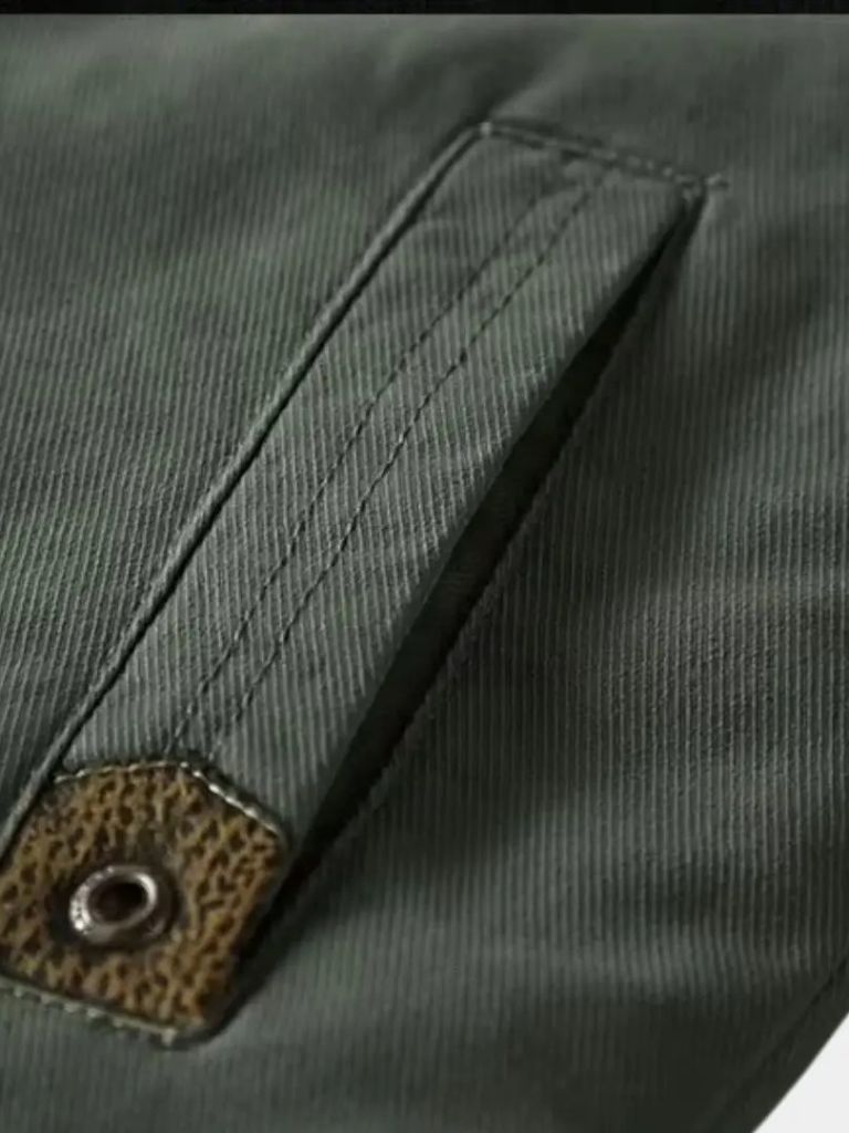 Vintage military aviator jacket by Montaracrest featuring a classic design and cross crown emblem on the front.